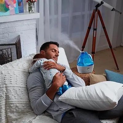 AquaOasis Cool Mist is on a man and a kid are happy